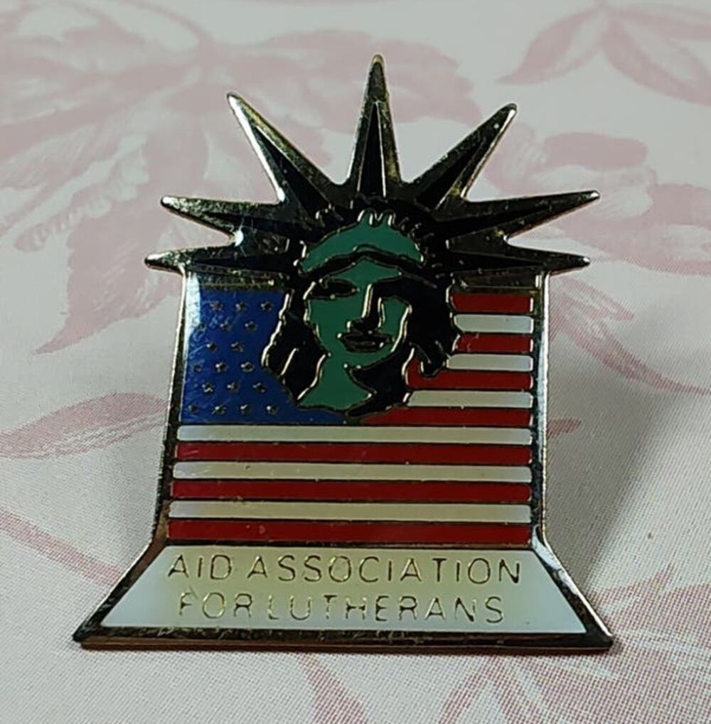 Aid Association for Lutherans 1983 Signed Statue of Liberty American Flag Pin